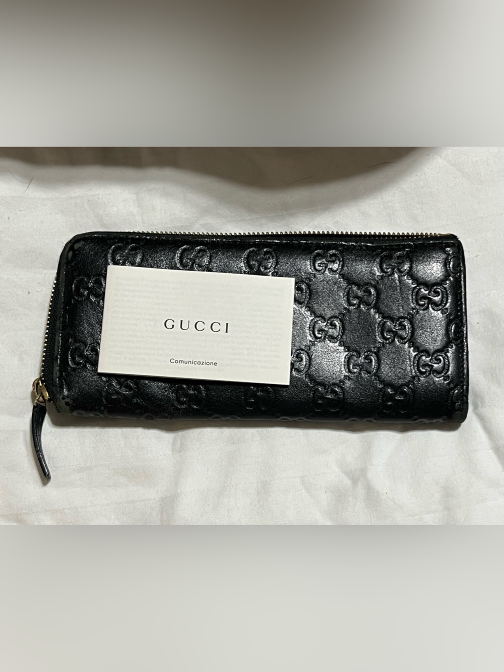Gucci Black Embossed Leather Zip Wallet
G-12